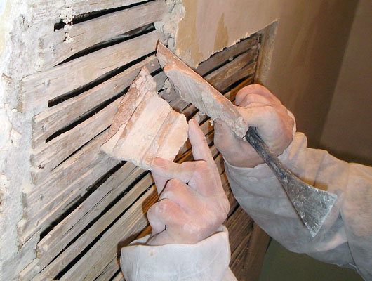 LATHE AND PLASTER: Carefully cutting away of plaster which has lost key